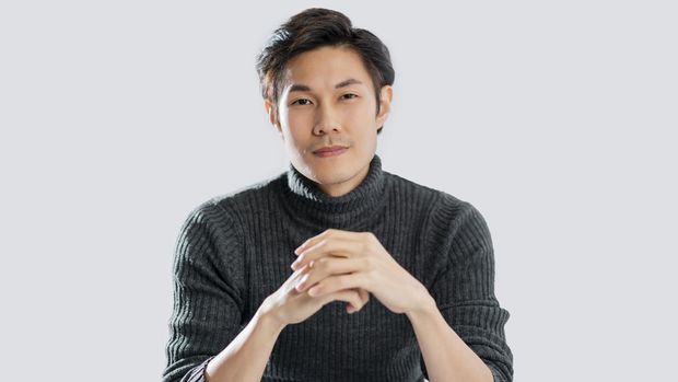portrait lifestyle studio shot white background of young smart active asian male wear sweater smile with positive emotion and confident relax casual asian male white background