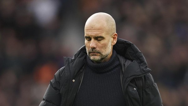 Pep Guardiola Manchester Citys head coach Pep Guardiola walks on the pitch after the English Premier League soccer match between Manchester United and Manchester City at Old Trafford in Manchester, England, Saturday, Jan. 14, 2023. (AP Photo/Dave Thompson)