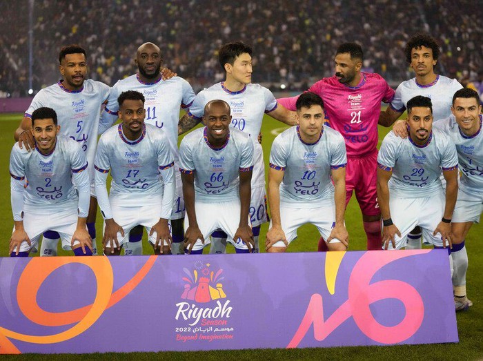Cristiano Ronaldo, right, poses with a combined XI of Saudi Arabian teams Al Nassr and Al Hilal prior to the start of a friendly soccer match against PSG, at the King Saud University Stadium, in Riyadh, Saudi Arabia, Thursday, Jan. 19, 2023. (AP Photo/Hussein Malla)