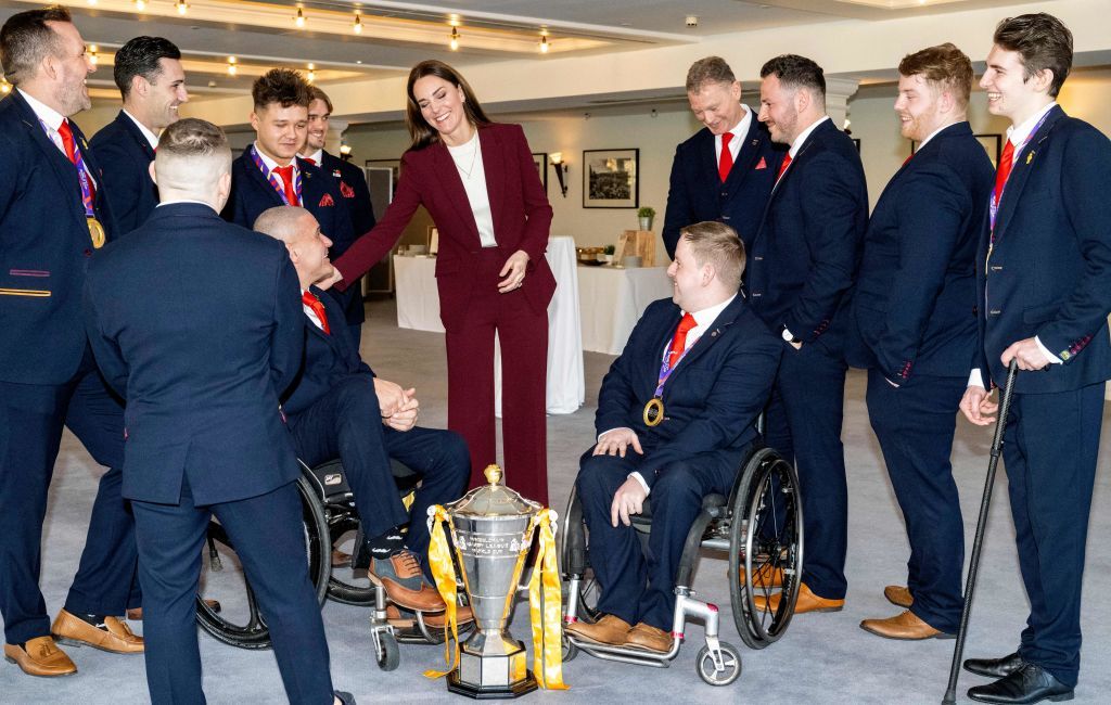 Britain's Catherine, Princess of Wales (C) talks with players and coaching staff as she hosts a reception in recognition of the success of the England Wheelchair Rugby League team at the recent Rugby League World Cup, at Hampton Court Palace in southwest London on January 19, 2023. (Photo by Mark Large / POOL / AFP) (Photo by MARK LARGE/POOL/AFP via Getty Images)