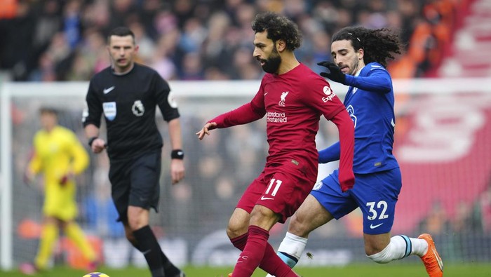 Liverpools Mohamed Salah, left, challenges for the ball with Chelseas Marc Cucurella during the English Premier League soccer match between Liverpool and Chelsea at Anfield stadium in Liverpool, England, Saturday, Jan. 21, 2023. (AP Photo/Jon Super)
