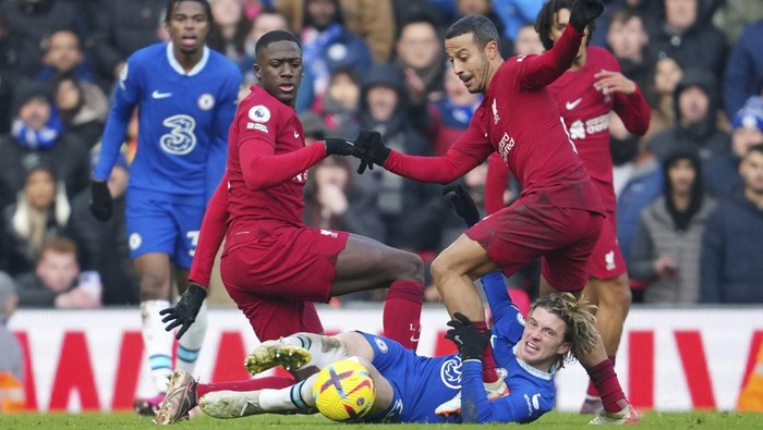 Chelseas Conor Gallagher clears a ball next to Liverpools Thiago, right, during the English Premier League soccer match between Liverpool and Chelsea at Anfield stadium in Liverpool, England, Saturday, Jan. 21, 2023. (AP Photo/Jon Super)