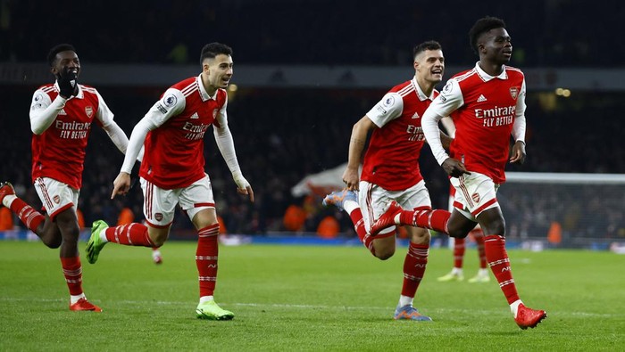 Soccer Football - Premier League - Arsenal v Manchester United - Emirates Stadium, London, Britain - January 22, 2023 Arsenals Bukayo Saka celebrates scoring their second goal with Eddie Nketiah, Gabriel Martinelli and Granit Xhaka Action Images via Reuters/Peter Cziborra EDITORIAL USE ONLY. No use with unauthorized audio, video, data, fixture lists, club/league logos or live services. Online in-match use limited to 75 images, no video emulation. No use in betting, games or single club /league/player publications.  Please contact your account representative for further details.