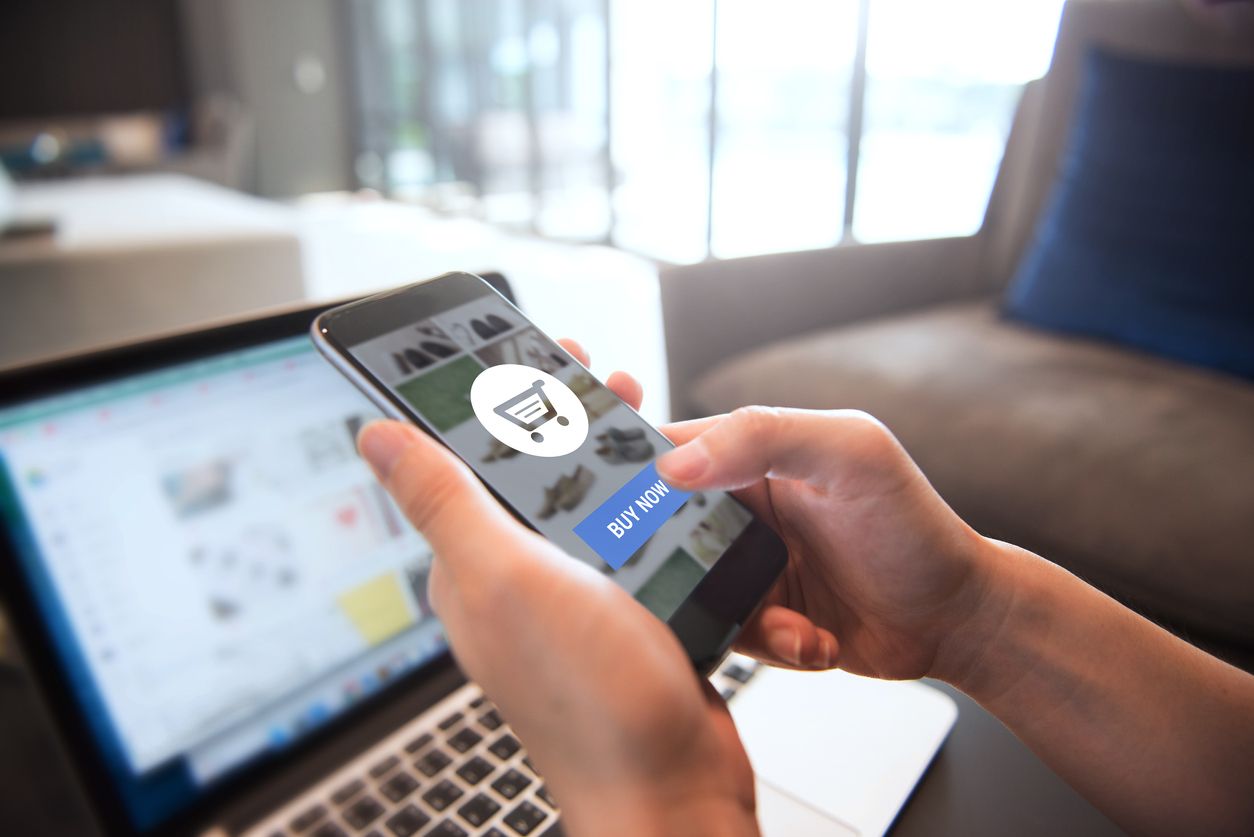 Online payment. Hands of woman using mobile smartphone and laptop computer for online shopping.