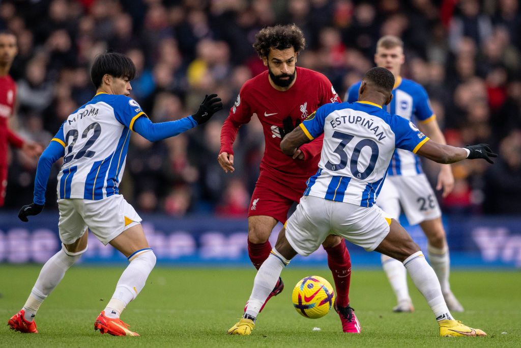 BRIGHTON, ENGLAND - JANUARY 14: Mohamed Salah of Liverpool FC and Kaoru Mitoma and Pervis Estupiñan of Brighton & Hove Albion in action during the Premier League match between Brighton & Hove Albion and Liverpool FC at American Express Community Stadium on January 14, 2023 in Brighton, United Kingdom. (Photo by Sebastian Frej/MB Media/Getty Images)