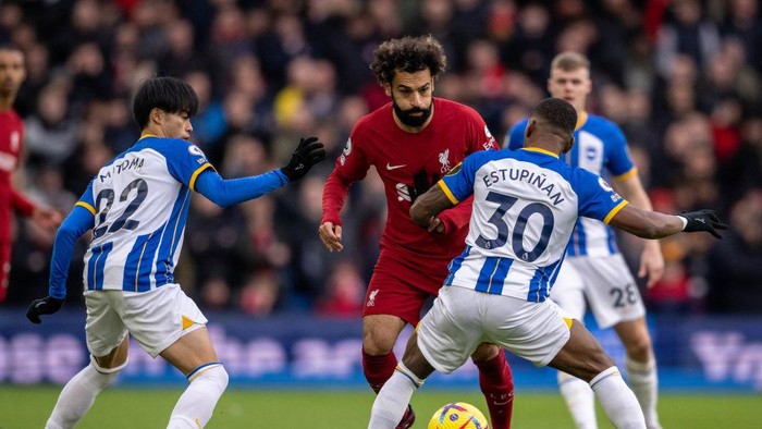 BRIGHTON, ENGLAND - JANUARY 14: Mohamed Salah of Liverpool FC and Kaoru Mitoma and Pervis Estupiñan of Brighton & Hove Albion in action during the Premier League match between Brighton & Hove Albion and Liverpool FC at American Express Community Stadium on January 14, 2023 in Brighton, United Kingdom. (Photo by Sebastian Frej/MB Media/Getty Images)