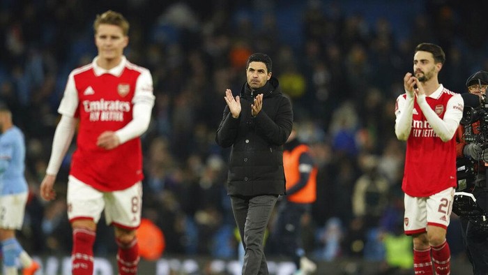 Arsenals manager Mikel Arteta walks at the end of the English FA Cup 4th round soccer match between Manchester City and Arsenal at the Etihad Stadium in Manchester, England, Friday, Jan. 27, 2023. Manchester City won 1-0. (AP Photo/Dave Thompson)