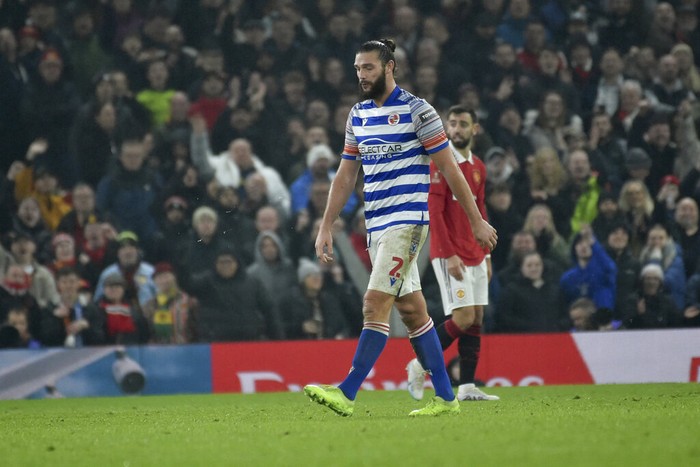 Readings Andy Carroll walks off the pitch after being sent off for a second bookable offence during the English FA Cup 4th round soccer match between Manchester United and Reading at Old Trafford in Manchester, England, Saturday, Jan. 28, 2023. (AP Photo/Rui Vieira)