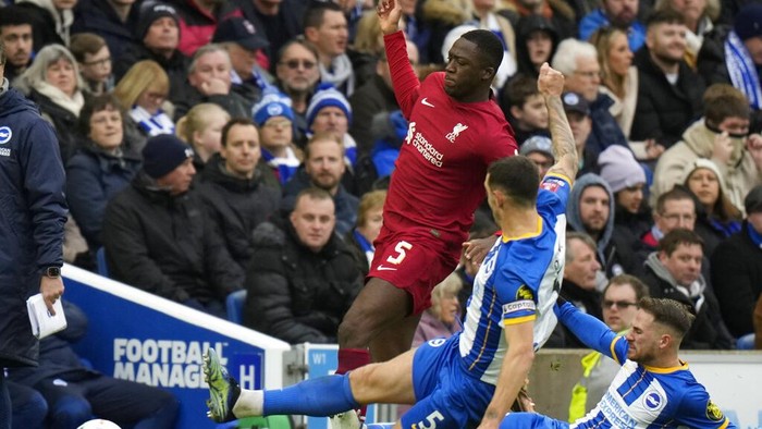 Liverpools Ibrahima Konate is tackled by Brightons Lewis Dunk during the FA Cup 4th round soccer match between Brighton and Hove Albion and Liverpool at the Falmer Stadium in Brighton, England, Sunday, Jan. 29, 2023. (AP Photo/Alastair Grant)