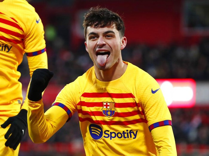 Barcelona's Pedri celebrates after scoring the opening goal during the Spanish La Liga soccer match between Girona and FC Barcelona at the Montilivi stadium in Girona, Spain, Saturday, Jan. 28, 2023. (AP Photo/Joan Monfort)