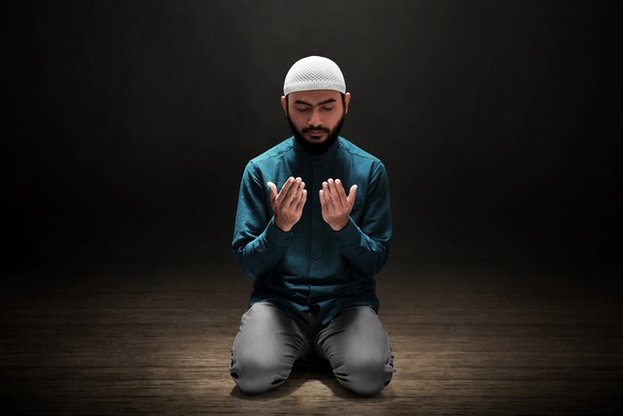 Muslim man praying in the mosque