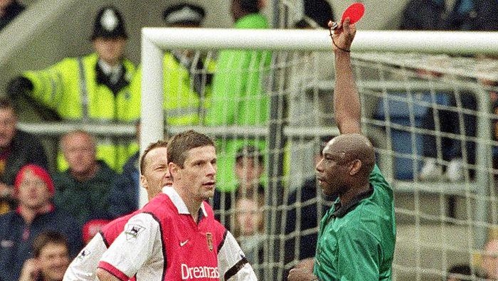 1 Apr 2000:  Oleg Luzhny of Arsenal is sent off by referee Uriah Rennie during the FA Carling Premiership match against Wimbledon at Selhurst Park in London. Arsenal won 3-1. \ Mandatory Credit:  Craig Prentis /Allsport