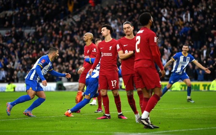 Liverpool BRIGHTON, ENGLAND - JANUARY 29: Curtis Jones of Liverpool reacts as Kaoru Mitoma of Brighton & Hove Albion (obscured) celebrates after scoring the team's second goal during the Emirates FA Cup Fourth Round match between Brighton & Hove Albion and Liverpool FC at Amex Stadium on January 29, 2023 in Brighton, England. (Photo by Mike Hewitt/Getty Images)