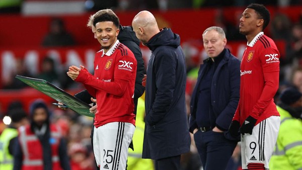 Jadon Sancho MANCHESTER, ENGLAND - FEBRUARY 01: Jadon Sancho of Manchester United and Erik Ten Hag the manager / head coach of Manchester United during the Carabao Cup Semi Final 2nd Leg match between Manchester United and Nottingham Forest at Old Trafford on February 1, 2023 in Manchester, England. (Photo by Robbie Jay Barratt - AMA/Getty Images)