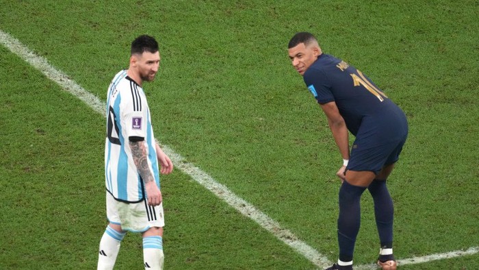 LUSAIL CITY, QATAR - DECEMBER 18: Kylian Mbappe of France and Lionel Messi of Argentina are seen during the FIFA World Cup Qatar 2022 Final match between Argentina and France at Lusail Stadium on December 18, 2022 in Lusail City, Qatar. (Photo by Etsuo Hara/Getty Images)