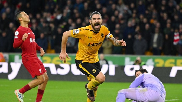 WOLVERHAMPTON, ENGLAND - FEBRUARY 04: Ruben Neves of Wolverhampton Wanderers celebrates after scoring the teams third goal during the Premier League match between Wolverhampton Wanderers and Liverpool FC at Molineux on February 04, 2023 in Wolverhampton, England. In a Premier League first, both sets of players, and match officials, will wear Green Football Weekend sustainable green armbands to highlight the initiative and put the conversation about climate change and sustainability on the world stage. (Photo by Clive Mason/Getty Images)