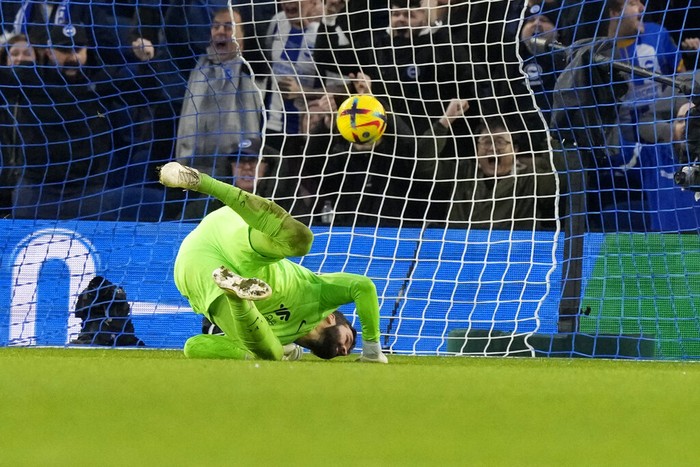 Liverpools goalkeeper Alisson fails to save Brightons Solly Marchs shot who scored his sides opening goal during the English Premier League soccer match between Brighton and Liverpool at the Falmer Stadium in Brighton, England, Saturday, Jan. 14, 2023. (AP Photo/Frank Augstein)