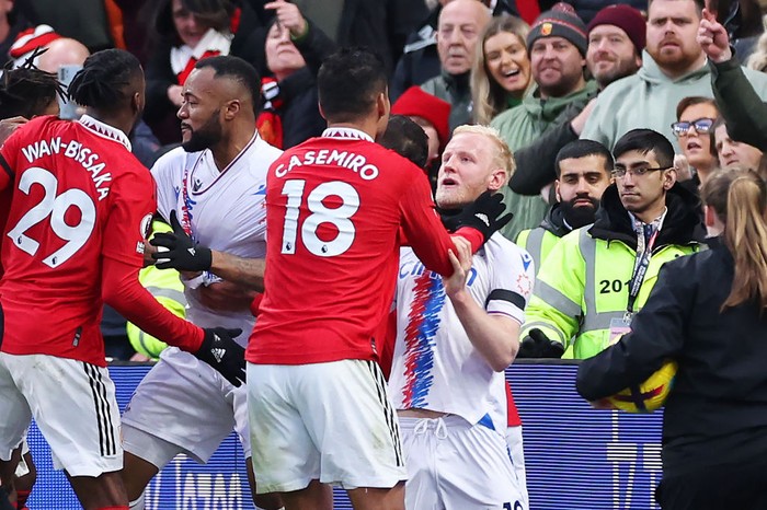 MANCHESTER, ENGLAND - FEBRUARY 04: Casemiro of Manchester United clashes with Will Hughes of Crystal Palace leading to a red card decision during the Premier League match between Manchester United and Crystal Palace at Old Trafford on February 04, 2023 in Manchester, England. (Photo by Alex Livesey/Getty Images)