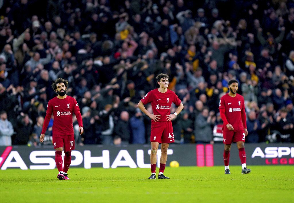 Liverpool's Mohamad Salah, Stefan Bajcetic and Joe Gomez look on after Wolverhampton Wanderers' Ruben Neves scores his side's third goal of the game, during the English Premier League soccer match between Wolverhampton Wanderers and Liverpool, at Molineux Stadium, in Wolverhampton, England, Saturday, Feb. 4, 2023. (Tim Goode/PA via AP)