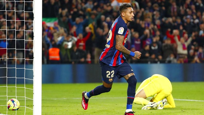 Barcelona's Raphinha celebrates after scoring his side's third goal during a Spanish La Liga soccer match between Barcelona and Sevilla at the Camp Nou stadium in Barcelona, Spain, Sunday, Feb. 5, 2023. (AP Photo/Joan Monfort)