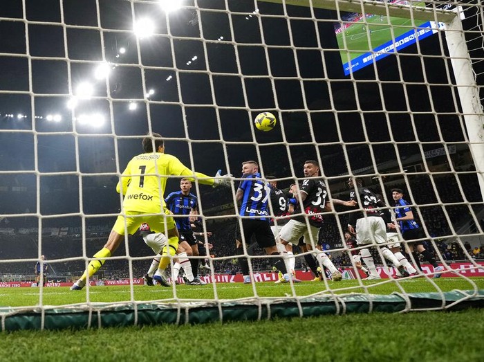 Inter Milan's Lautaro Martinez scores his side's opening goal during the Serie A soccer match between Inter Milan and AC Milan at the San Siro Stadium, in Milan, Italy, Sunday, Feb. 5, 2023. (AP Photo/Antonio Calanni)