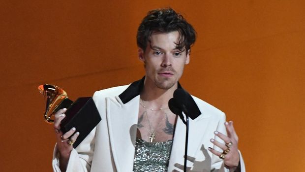 English singer-songwriter Harry Styles accepts the award for Album Of The Year for 