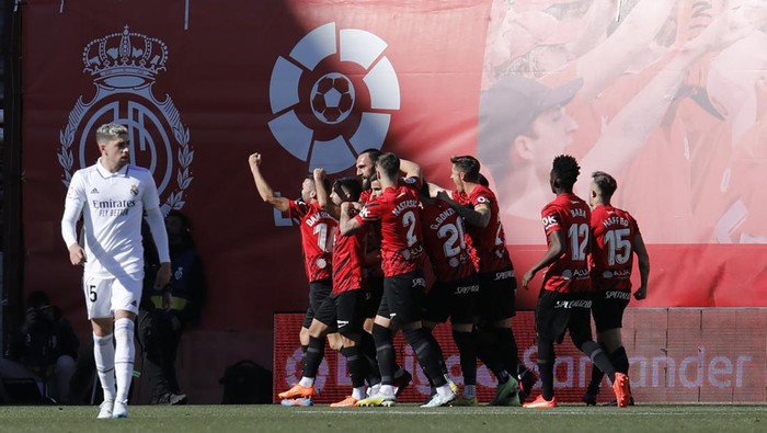 Mallorca players celebrate after Mallorcas Vedat Muriqi scored his sides opening goal during a Spanish La Liga soccer match between Mallorca and Real Madrid at the Son Moix stadium in Palma de Mallorca, Spain, Sunday, Feb. 5, 2023. (AP Photo/Francisco Ubilla)