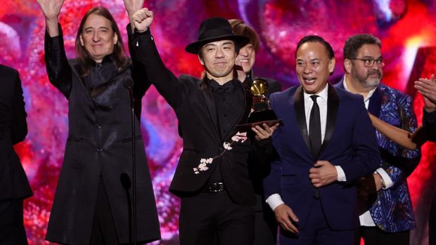 LOS ANGELES, CALIFORNIA - FEBRUARY 05: Masa Takumi poses with the Best Global Music Album award for Sakurain the press room during the 65th GRAMMY Awards at Crypto.com Arena on February 05, 2023 in Los Angeles, California. (Photo by Alberto E. Rodriguez/Getty Images for The Recording Academy)
