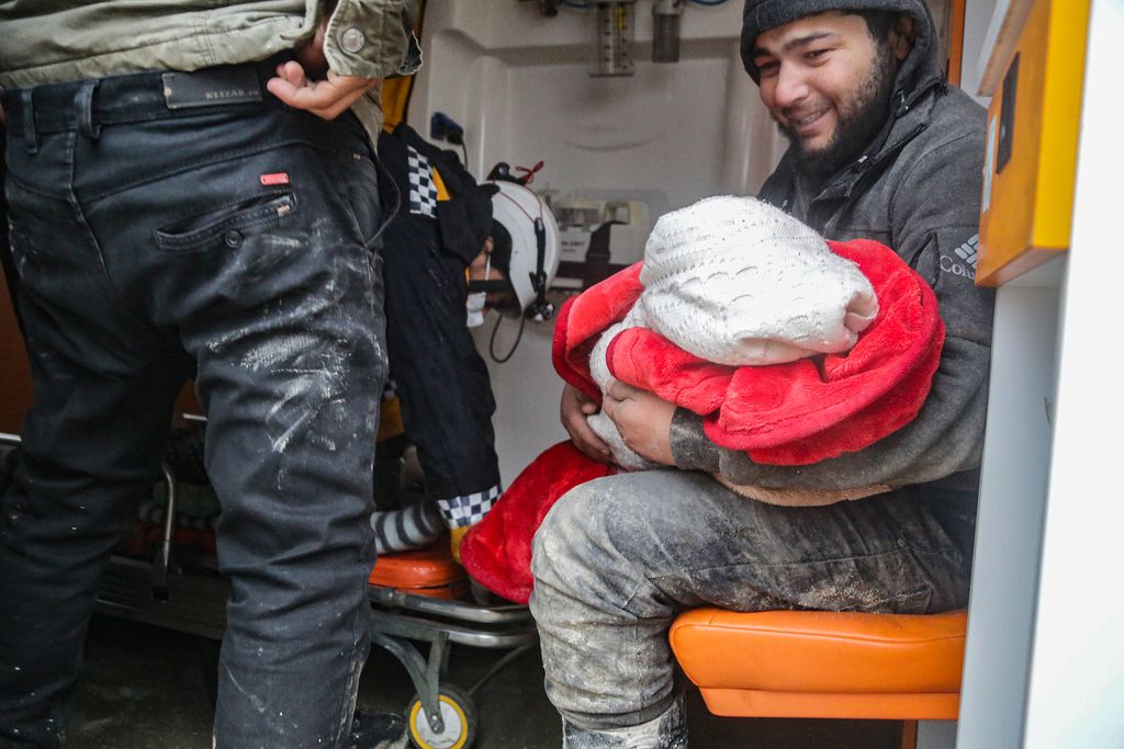 ALEPPO, SYRIA - FEBRUARY 06: Search and rescue operations conduct on a collapsed buildings after a 7.4 magnitude Kahramanmaras earthquake shakes Aleppo, Syria on February 06, 2023. The 7.4 magnitude earthquake jolted southern province of Kahramanmaras of Turkiye early Monday, according to Disaster and Emergency Management Authority of Turkiye (AFAD). It was followed by a magnitude 6.4 quake that struck southeastern Gaziantep province. A third earthquake with a 6.5 magnitude also hit Gaziantep. Earthquakes had affected several provinces including, Osmaniye, Malatya, Adiyaman, Adana, Diyarbakir, Kilis and Sanliurfa. 7.5 Magnitude earthquake also strongly felt and had casualties in Syria. (Photo by Omer Alven/Anadolu Agency via Getty Images)