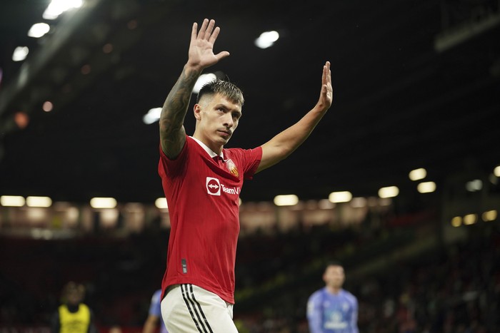 Manchester Uniteds Lisandro Martinez waves after the English Premier League soccer match between Manchester United and Bournemouth at Old Trafford in Manchester, England, Tuesday, Jan. 3, 2023. (AP Photo/Dave Thompson)