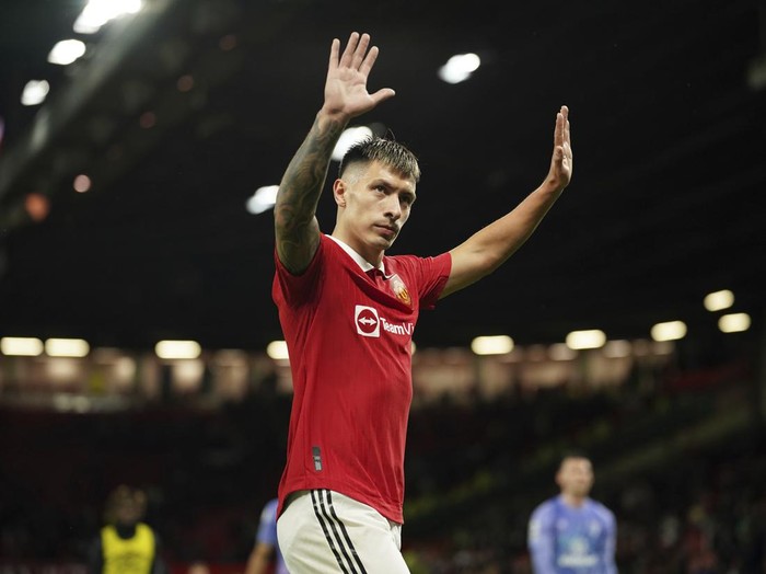 Manchester United's Lisandro Martinez waves after the English Premier League soccer match between Manchester United and Bournemouth at Old Trafford in Manchester, England, Tuesday, Jan. 3, 2023. (AP Photo/Dave Thompson)
