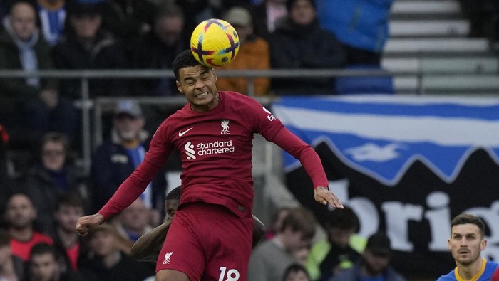 Liverpools Cody Gakpo jumps for a header during the English Premier League soccer match between Brighton and Liverpool at the Falmer Stadium in Brighton, England, Saturday, Jan. 14, 2023. (AP Photo/Frank Augstein)