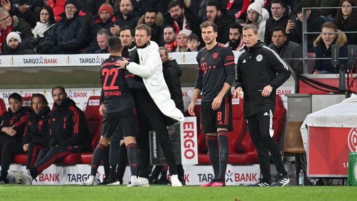 01 February 2023, Rhineland-Palatinate, Mainz: Soccer: DFB Cup, FSV Mainz 05 - Bayern Munich, Round of 16 at Mewa Arena, coaches Julian Nagelsmann and Joao Cancelo. IMPORTANT NOTE: In accordance with the requirements of the DFL Deutsche Fußball Liga and the DFB Deutscher Fußball-Bund, it is prohibited to use or have used photographs taken in the stadium and/or of the match in the form of sequence pictures and/or video-like photo series. Photo: Torsten Silz/dpa (Photo by Torsten Silz/picture alliance via Getty Images)