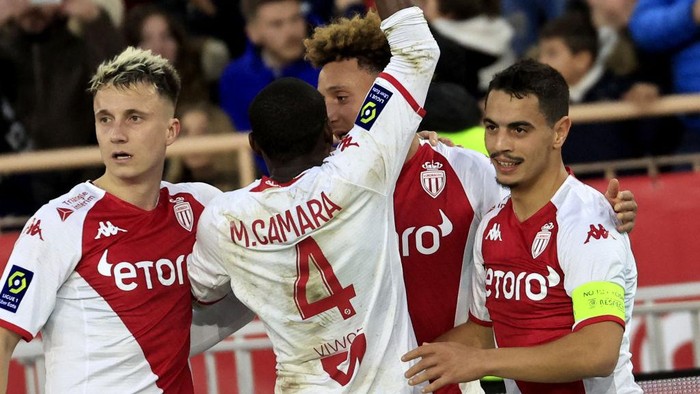 Monacos French forward Wissam Ben Yedder (R) celebrates with team mates after scoring a goal during the French L1 football match between Monaco and Paris Saint-Germain (PSG) at the Louis II stadium in Monaco on February 11, 2023. (Photo by Valery HACHE / AFP) (Photo by VALERY HACHE/AFP via Getty Images)