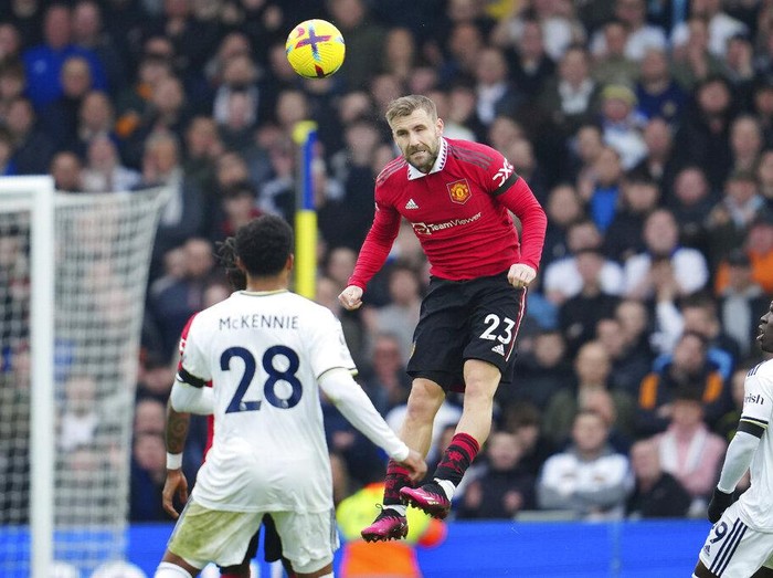 Manchester United's Luke Shaw heads the ball during the English Premier League soccer match between Leeds United and Manchester United at Elland Road, Leeds, England, Sunday, Feb.12, 2023. (AP Photo/Jon Super)