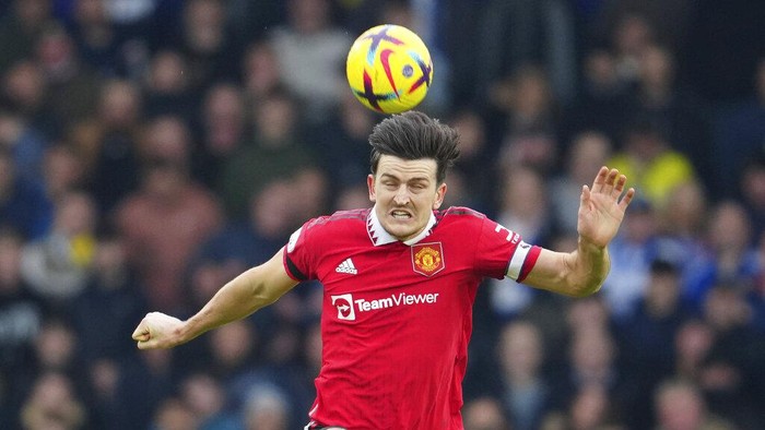 Manchester Uniteds Harry Maguire heads the ball during the English Premier League soccer match between Leeds United and Manchester United at Elland Road, Leeds, England, Sunday, Feb.12, 2023. (AP Photo/Jon Super)