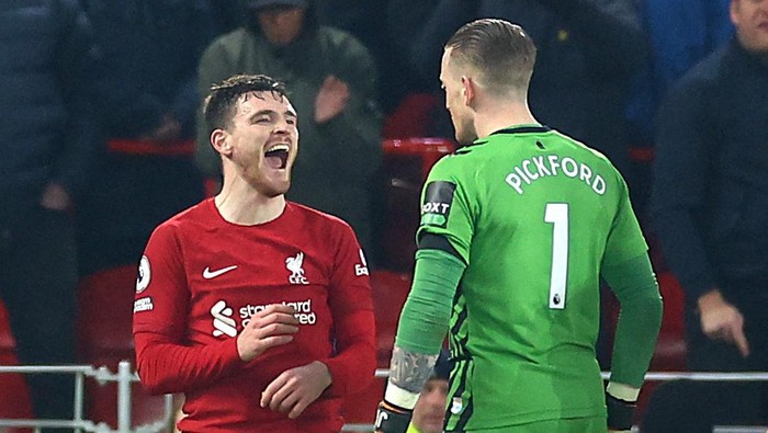 Soccer Football - Premier League - Liverpool v Everton - Anfield, Liverpool, Britain - February 13, 2023 Liverpools Andrew Robertson clashes with Evertons Jordan Pickford REUTERS/Carl Recine EDITORIAL USE ONLY. No use with unauthorized audio, video, data, fixture lists, club/league logos or live services. Online in-match use limited to 75 images, no video emulation. No use in betting, games or single club /league/player publications.  Please contact your account representative for further details.