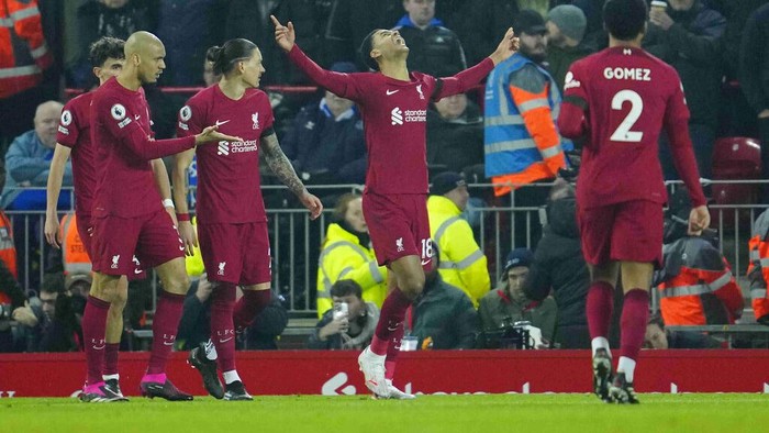 Liverpools Cody Gakpo, centre, celebrates after scoring his sides second goal during the English Premier League soccer match between Liverpool and Everton at the Anfield stadium in Liverpool, England, Monday, Feb. 13, 2023. (AP Photo/Jon Super)