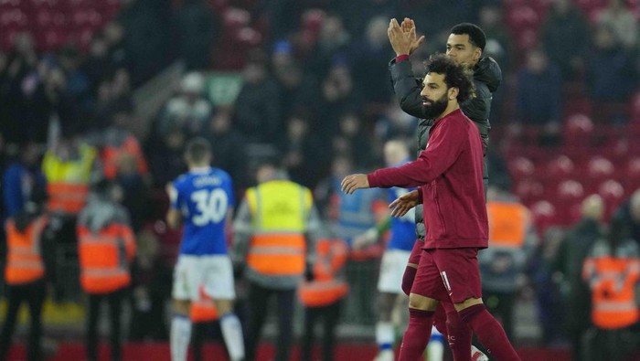 Cody Gakpo, Mohamed Salah, Liverpool vs Everton Liverpool's Mohamed Salah walks from the field with Liverpool's Cody Gakpo, rear, after the English Premier League soccer match between Liverpool and Everton at the Anfield stadium in Liverpool, England, Monday, Feb. 13, 2023. (AP Photo/Jon Super)