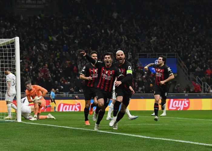 MILAN, ITALY - FEBRUARY 14:  Brahim Diaz of AC Milan celebrate with team-mates after scoring the opening goal during the UEFA Champions League round of 16 leg one match between AC Milan and Tottenham Hotspur at Giuseppe Meazza Stadium on February 14, 2023 in Milan, Italy. (Photo by Claudio Villa/AC Milan via Getty Images)