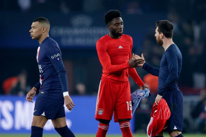 PARIS, FRANCE - FEBRUARY 14: Kylian Mbappe of Paris Saint Germain, Alphonso Davies of Bayern Munchen, Lionel Messi of Paris Saint Germain during the UEFA Champions League match between Paris Saint Germain v Bayern Munchen at the Parc des Princes on February 14, 2023 in Paris France (Photo by David S. Bustamante/Soccrates/Getty Images)