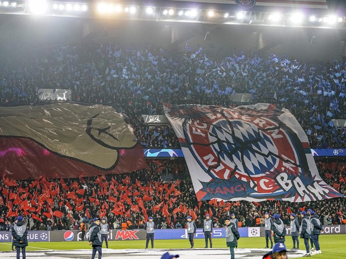 PARIS, FRANCE - FEBRUARY 14: Supporters of Paris Saint German with flags and banner during the UEFA Champions League round of 16 leg one match between Paris Saint-Germain and FC Bayern München at Parc des Princes on February 14, 2023 in Paris, France. (Photo by Alex Gottschalk/DeFodi Images via Getty Images)