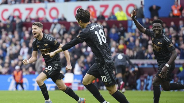 Arsenals Jorginho, left, celebrates after scoring during the English Premier League soccer match between Aston Villa and Arsenal at Villa Park in Birmingham, England, Saturday, Feb. 18, 2023. (AP Photo/Jon Super)