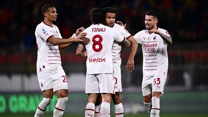AC Milans Brazilian forward Junior Messias (C-R) celebrates with AC Milans Italian midfielder Sandro Tonali (C-L), AC Milans Bosnian midfielder Rade Krunic (R) and AC Milans German-Finnish defender Malick Thiaw after opening the scoring during the Italian Serie A football match between Monza and AC Milan on February 18, 2023 at the Brianteo stadium in Monza. (Photo by Marco BERTORELLO / AFP) (Photo by MARCO BERTORELLO/AFP via Getty Images)