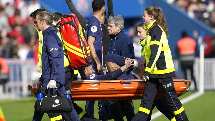PSGs Neymar is carried off the field on a stretcher after after injuring during the French League One soccer match between Paris Saint-Germain and Lille at the Parc des Princes stadium, in Paris, France, Sunday, Feb. 19, 2023. (AP Photo/Christophe Ena)