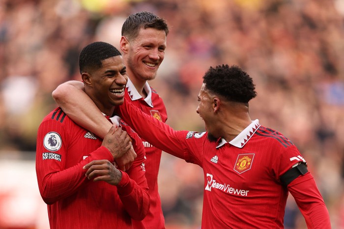 MANCHESTER, ENGLAND - FEBRUARY 19: Marcus Rashford of Manchester United celebrates after scoring the teams second goal with teammates Wout Weghorst and Jadon Sancho during the Premier League match between Manchester United and Leicester City at Old Trafford on February 19, 2023 in Manchester, England. (Photo by Richard Heathcote/Getty Images)