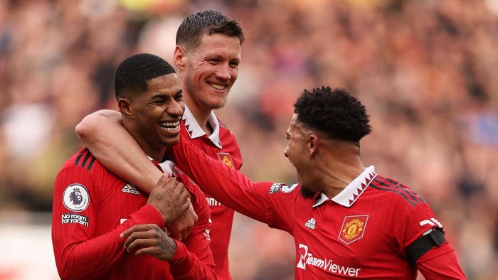 MANCHESTER, ENGLAND - FEBRUARY 19: Marcus Rashford of Manchester United celebrates after scoring the teams second goal with teammates Wout Weghorst and Jadon Sancho during the Premier League match between Manchester United and Leicester City at Old Trafford on February 19, 2023 in Manchester, England. (Photo by Richard Heathcote/Getty Images)