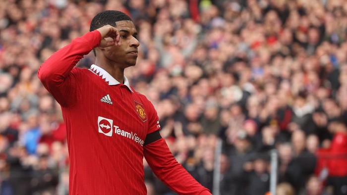 MANCHESTER, ENGLAND - FEBRUARY 19: Marcus Rashford of Manchester United celebrates scoring their first goal during the Premier League match between Manchester United and Leicester City at Old Trafford on February 19, 2023 in Manchester, England. (Photo by Matthew Peters/Manchester United via Getty Images)