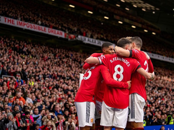 MANCHESTER, ENGLAND - FEBRUARY 19:  Jadon Sancho of Manchester United celebrates scoring a goal to make the score 3-0 with team-mates during the Premier League match between Manchester United and Leicester City at Old Trafford on February 19, 2023 in Manchester, United Kingdom. (Photo by Ash Donelon/Manchester United via Getty Images)