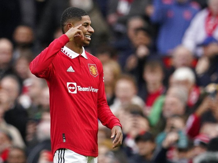 Manchester United's Marcus Rashford celebrates after scoring his side's second goal during the English Premier League soccer match between Manchester United and Leicester City at the Stamford Bridge stadium in Manchester, England, Sunday, Feb. 19, 2023. (AP Photo/Dave Thompson)